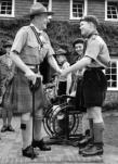 Lord Rowallan, Chief Scout, visit to Chailey in 1955. Lord Rowallan shaking hands with Harry Smith, Patrol Leader.